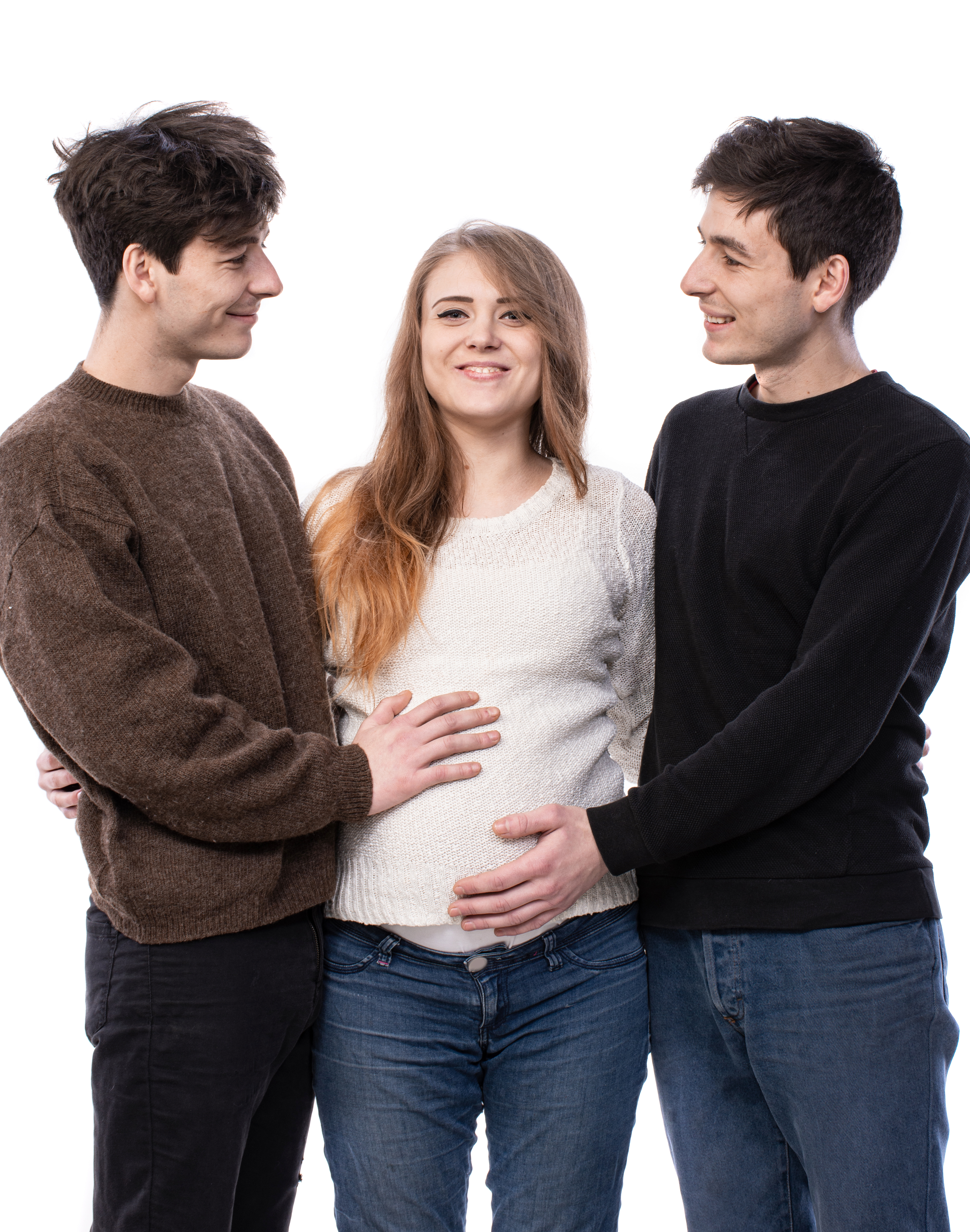Pregnant Surrogate and Intended Parents Laughing